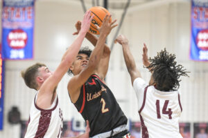 Woodrow Wilson races past University behind Redfern's 32 points